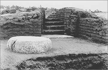 House of Ranefer: the front (transverse) hall with column base. In the foreground is the edge of a stratigraphic pit. Facing north-west. EES negative 21/61.