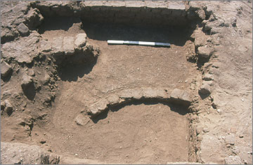 Part of a circular granary wall belonging to the Phase 1 house, buried beneath the Ranefer complex.