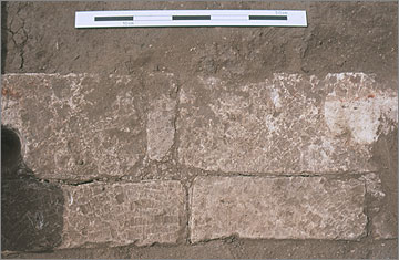 The limestone threshold of the entrance to the phase 1 house.
