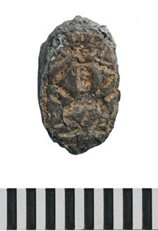 Figure 21: The bezel of a small finger ring decorated with a Bes-figure excavated in Trench 3 (obj. 38361).